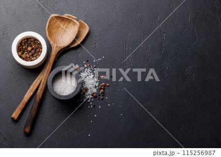 Spices, olive oil, and utensils on cooking table Spices, olive oil, and utensils on cooking table 115256987