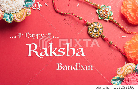 Raksha Bandhan, Indian festival with beautiful Rakhi and Rice Grains.  A traditional Indian wrist band which is a symbol of love between Sisters and Brothers. 115258166