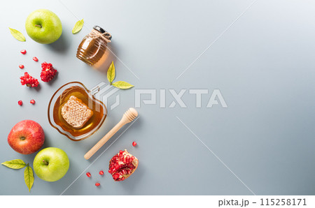 Rosh hashanah (Jewish New Year holiday), Concept of traditional or religion symbols on pastel background. Rosh hashanah (Jewish New Year holiday), Concept of traditional or religion symbols on pastel background. 115258171