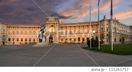 Vienna, Austria, August 17, 2022. Magnificent view of the Hofburg Imperial Palace at sunset, the warm evening light enhances the imposing facade. Large format shot. 115261757