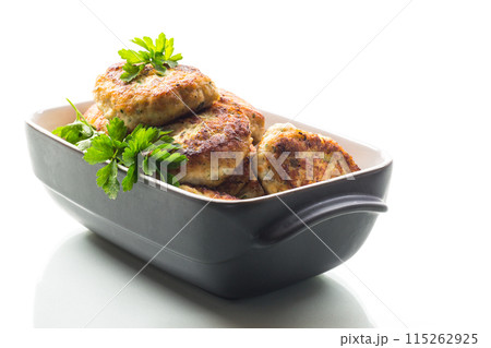 fried meat cutlets in a ceramic form on a wooden table fried meat cutlets in a ceramic form on a wooden table 115262925