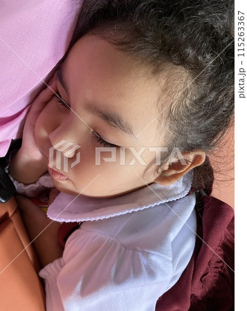 Portrait of cute Asian little girl sleeping in car 115263367