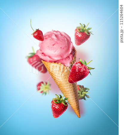 Composition levitation Strawberry ice cream waffle cone with Strawberries on blue background. In the air, vertical Composition levitation Strawberry ice cream waffle cone with Strawberries on blue background. In the air, vertical 115264604