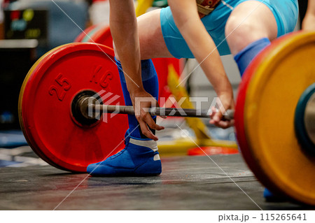 woman athlete deadlift exercise at powerlifting competition woman athlete deadlift exercise at powerlifting competition 115265641