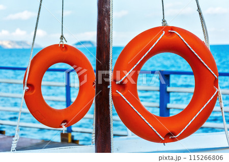 Two lifebuoys fixed ropes on the mast Two lifebuoys fixed ropes on the mast 115266806