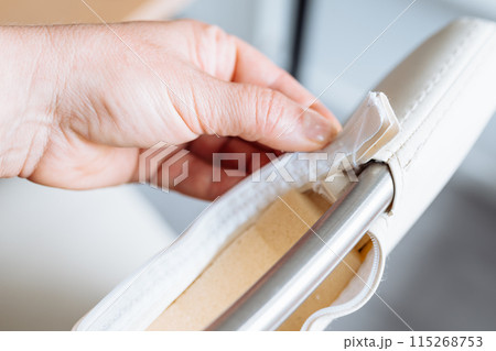 woman's hand demonstrates a torn zipper, damaged, woman's hand demonstrates a torn zipper, damaged, 115268753