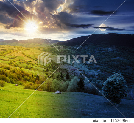 mountainous rural landscape on a summer solstice. fields and grassy meadows on rolling hills beneath a sky with sun and moon. day and night time change concept. fantasy countryside scenery in morning 115269662