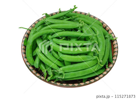 Green peas in a rustic bowl isolated on white background. Fresh peas in bowl. Bowls of vegetables. Green peas in a rustic bowl isolated on white background. Fresh peas in bowl. Bowls of vegetables. 115271873
