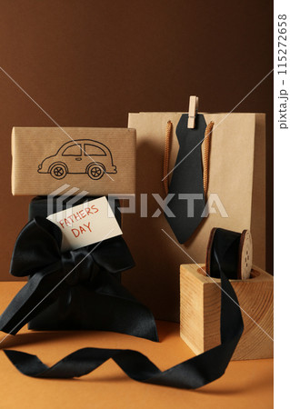 Concept of international father's day, gifts and greetings, on a brown background. 115272658