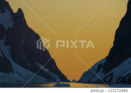 Lemaire strait coastal landscape, mountains and icebergs, Antarctic Peninsula, Antartica. 115272886