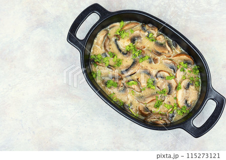 Mushrooms in creamy sauce. 115273121