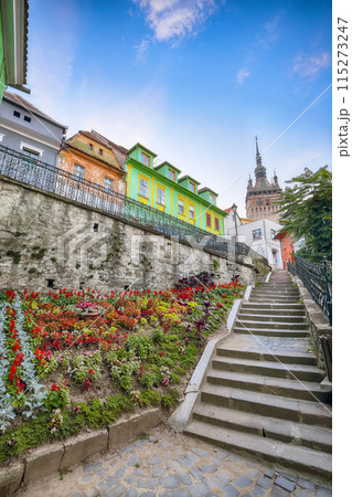 Amazing evening view of historic town Sighisoara and Clock Tower built by Saxons. Amazing evening view of historic town Sighisoara and Clock Tower built by Saxons. 115273247