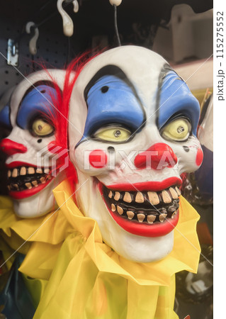 A scary clown in a shop Halloween Costume Store A scary clown in a shop Halloween Costume Store 115275552