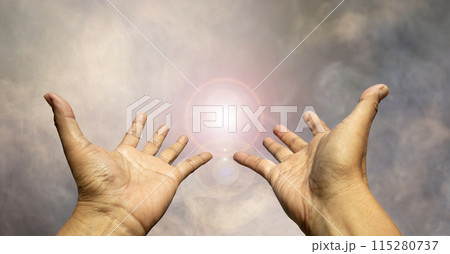 Two hands reaching for something the light in the haze. Two hands reaching for something the light in the haze. 115280737