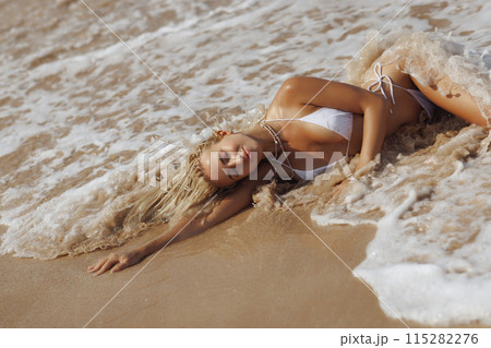 Tanned Blonde Woman in Red Bikini Posing in Nature Outdoors 115282276