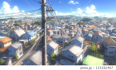 坂の上から眺める住宅街と夏空