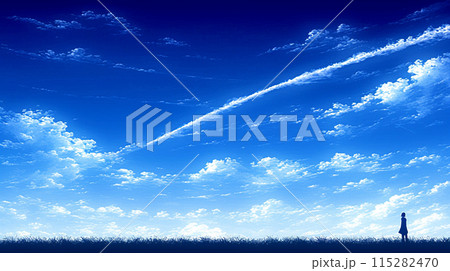 秋の高い青空に浮かぶ白い雲と飛行機