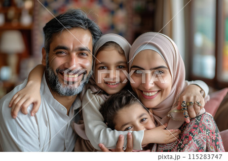 Happy Muslim Family Portrait In Home Setting 115283747