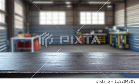 Industrial Metal Workshop: Blank Rough Desk Surface with Blurred Garage Background 115284208
