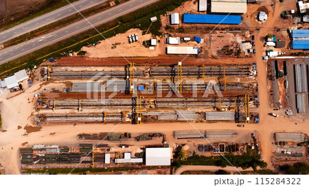 Aerial view of a cement bridge under construction. Road currently under construction at several levels to increase traffic Aerial view of a cement bridge under construction. Road currently under construction at several levels to increase traffic 115284322