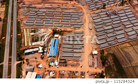 Aerial view of a cement bridge under construction. Road currently under construction at several levels to increase traffic Aerial view of a cement bridge under construction. Road currently under construction at several levels to increase traffic 115284324