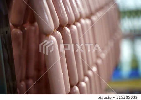 Production of meat sausages. Meat factory and industry. 115285089