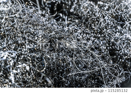 Metal shavings and waste in production. Waste metal in a factory Metal shavings and waste in production. Waste metal in a factory 115285132
