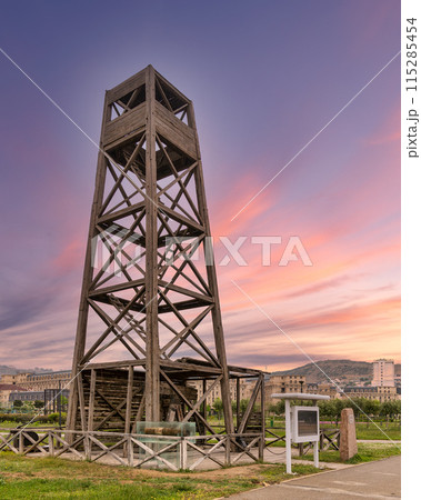 World's first industrially drilled oil well in Baku, Azerbaijan. The wooden structure stands tall against sunset sky 115285454