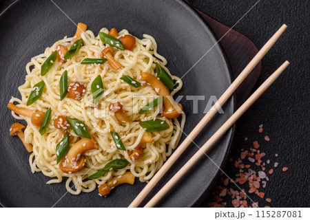 Delicious Asian cuisine dish with rice noodles, peppers, mushrooms and spices 115287081