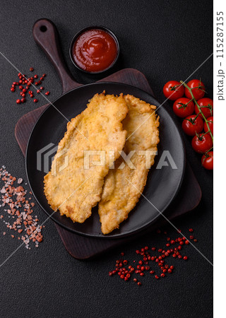 Delicious juicy chicken chops in batter with salt, spices and herbs Delicious juicy chicken chops in batter with salt, spices and herbs 115287155