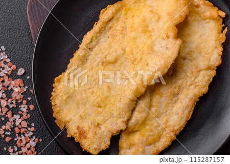 Delicious juicy chicken chops in batter with salt, spices and herbs Delicious juicy chicken chops in batter with salt, spices and herbs 115287157