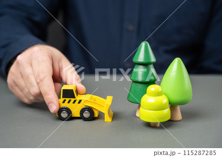 Timber cutting and processing. Threat to nature and ecology. Stop the forest from being cut down. Save nature. Protection of natural conservation areas. Deforestation. 115287285