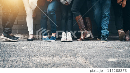 Outdoor, legs and people in row against wall while waiting, appointment and line for registration. Feet, shoes and footwear of crowd for voting outside by ground, pavement and cement in town 115288278