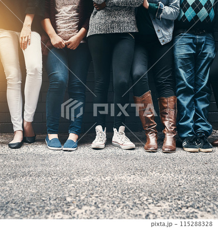 People, legs and shoes in row for friends against wall for business fashion and stylish outfit. Group, urban and footwear for employee line up of trendy and aesthetic clothes outdoor on street 115288328