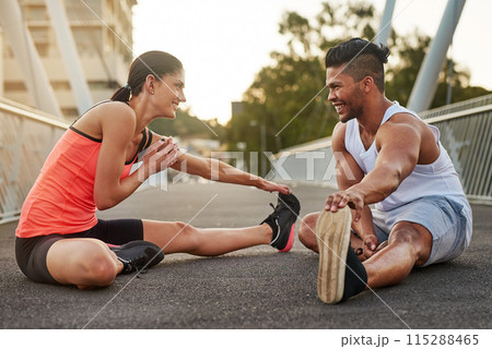 Smile, exercise and couple stretch on bridge for health, wellness or warmup for run. Man, woman and training on road for cardio, preparation and fitness together in city for marathon, jog or sprint 115288465