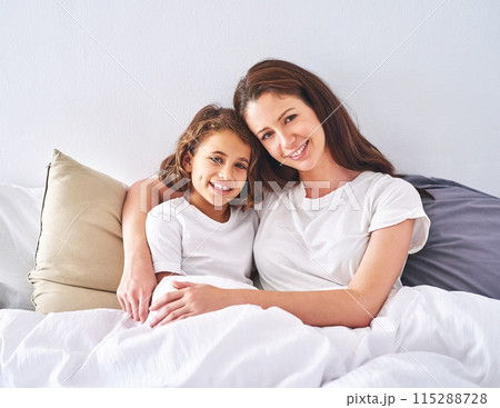 Portrait, bedroom or mother with girl in home to relax with care, safety or peace together for bonding. Smile, parent or mom with kid for support, trust or hug in happy family with love or protection 115288728