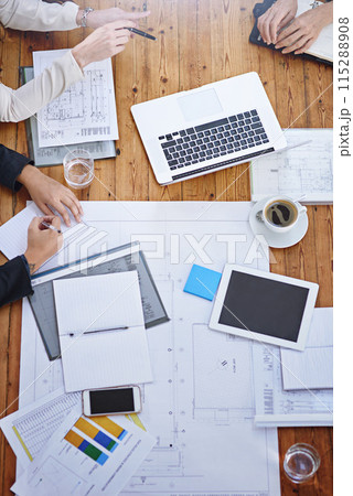 Top view, hands and blueprints with architect in office meeting for partnership, collaboration and planning. Workplace, boardroom or team with documents for architectural startup or project by above 115288908
