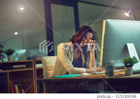 Office, computer and tired business woman for working late on online project, planning and networking. Corporate, professional and person exhausted on PC for proposal review, website and research 115289166