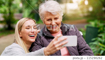 Wheelchair, senior woman and selfie at park for retirement, bonding or rehabilitation. Person with disability, mother and daughter happy together in nature for healthcare, support and mobility aid Wheelchair, senior woman and selfie at park for retirement, bonding or rehabilitation. Person with disability, mother and daughter happy together in nature for healthcare, support and mobility aid 115290262