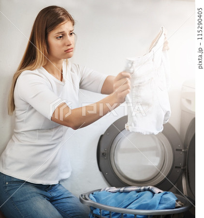 Sad, woman and cleaning laundry in home and frustrated with dirty clothes in washing machine, Girl, thinking and tired cleaner bleach white linen, fabric and textiles with disappointment in detergent 115290405