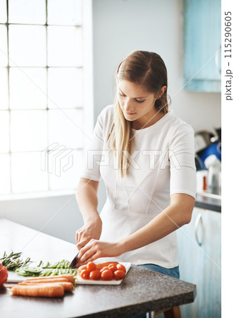 Woman, cooking and cutting in vegetables, kitchen and healthy meal for diet, home and nutrition. Vegetarian, organic and ingredients with food, soup and wellness or dinner, lunch with vitamins Woman, cooking and cutting in vegetables, kitchen and healthy meal for diet, home and nutrition. Vegetarian, organic and ingredients with food, soup and wellness or dinner, lunch with vitamins 115290605