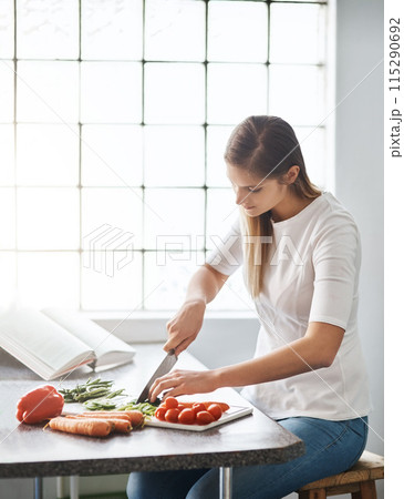Woman, kitchen and cutting in vegetables, vegan and healthy meal for cooking, recipe book and instruction. Vegetarian, organic and ingredients with food, diet and wellness or nutrition at home Woman, kitchen and cutting in vegetables, vegan and healthy meal for cooking, recipe book and instruction. Vegetarian, organic and ingredients with food, diet and wellness or nutrition at home 115290692