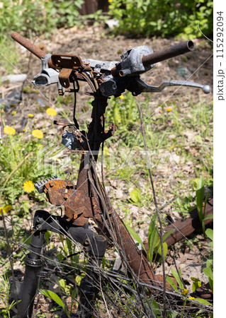 Burned rusty handlebar of motorbike closeup. Burned rusty handlebar of motorbike closeup. 115292094