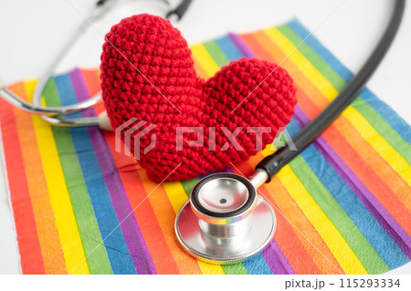 Black stethoscope on rainbow flag with heart, symbol of LGBT pride month celebrate annual in June social, symbol of gay, lesbian, bisexual, transgender, human rights and peace. 115293334