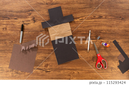 Flat lay. A dedicated teacher brings paper puppets to life, fostering creativity in the classroom through hands-on projects. Flat lay. A dedicated teacher brings paper puppets to life, fostering creativity in the classroom through hands-on projects. 115293424