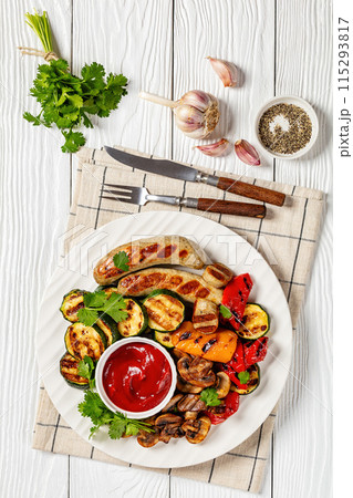 grilled white sausages with veggies and mushrooms 115293817