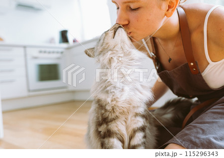 Portrait red-haired curly young woman with beloved fluffy domestic cat Portrait red-haired curly young woman with beloved fluffy domestic cat 115296343