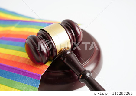 Gavel for judge lawyer on rainbow flag, symbol of LGBT pride month. 115297269