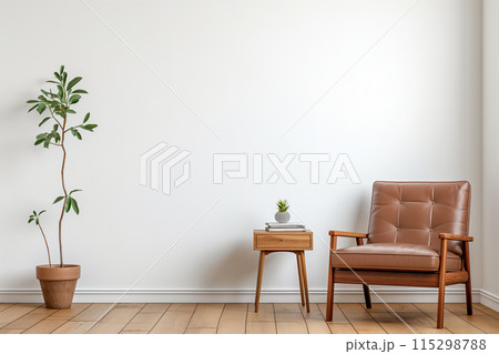 Minimalist living room with a clean and cozy aesthetic, featuring a brown leather armchair 115298788