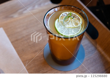 A glass of iced lemon tea on the wooden tray A glass of iced lemon tea on the wooden tray 115298880